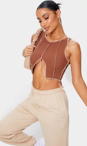 Короткий топ в рубчик зі швами світлими 